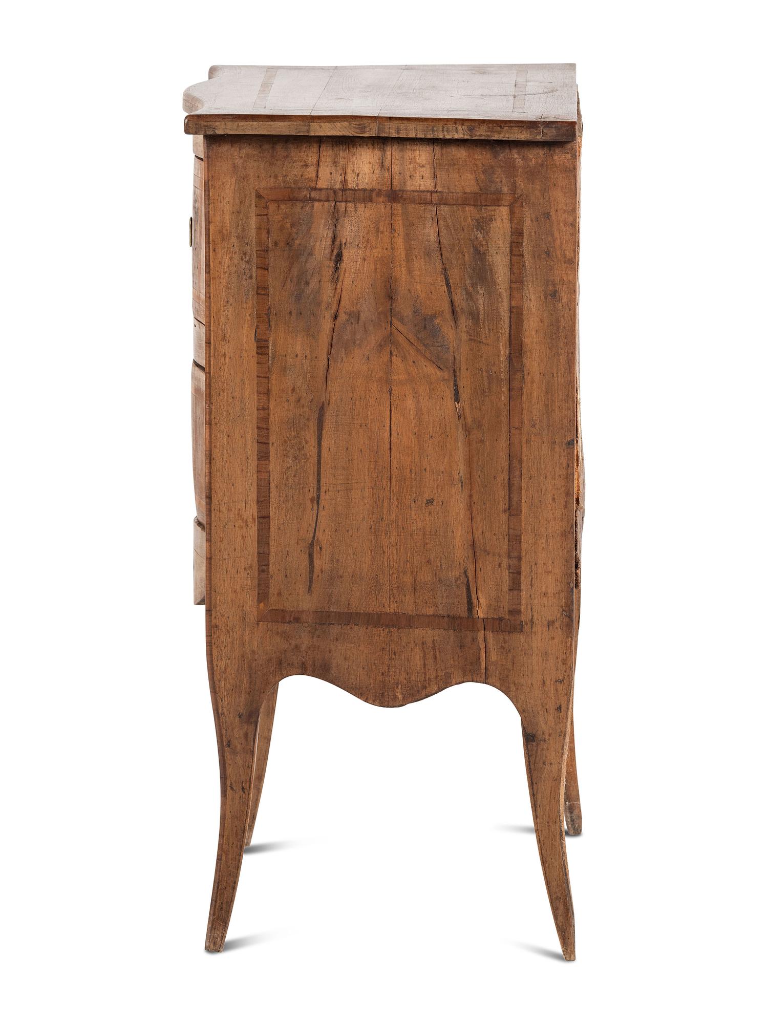 An Inlaid Walnut Commode
