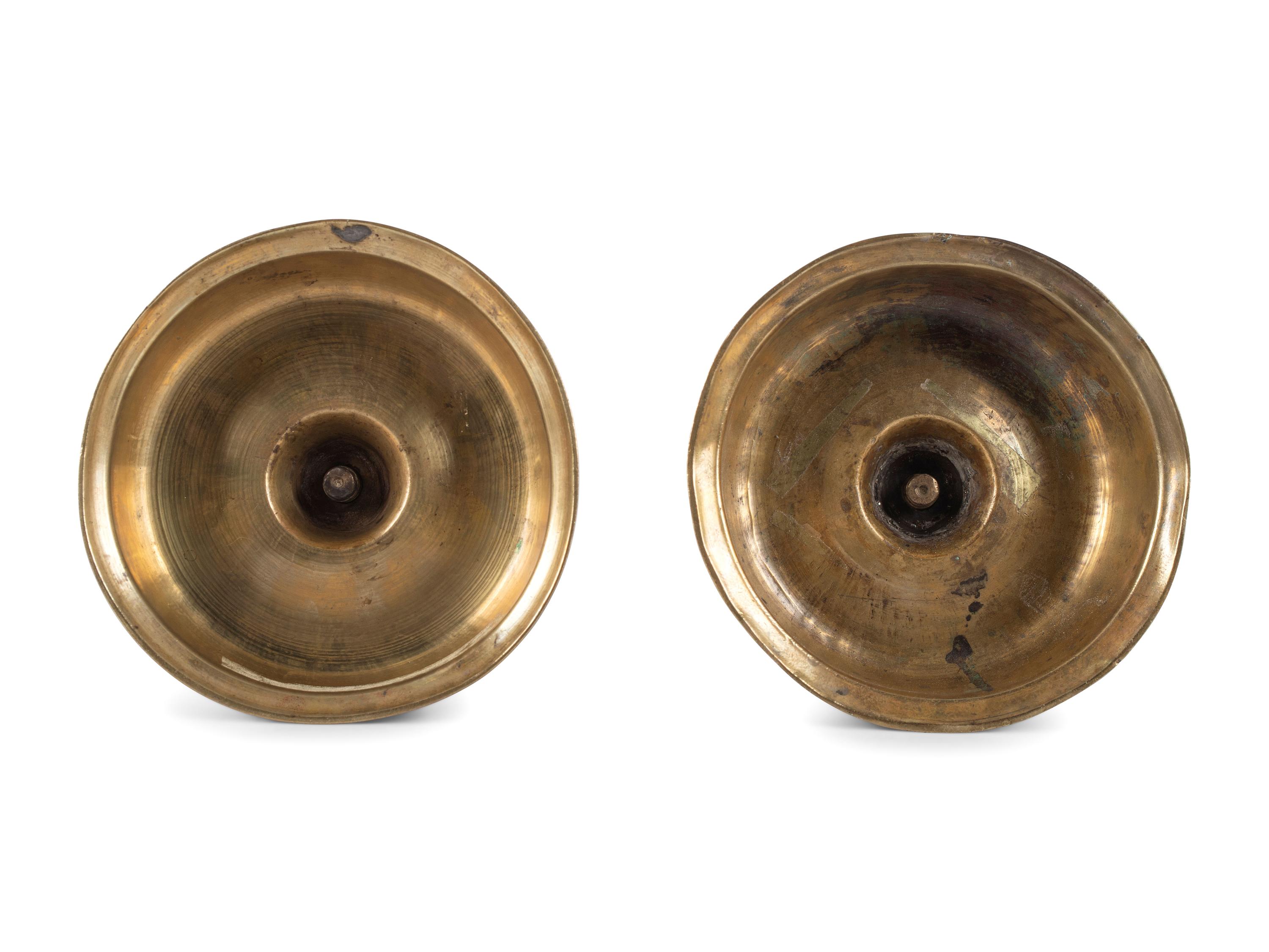 A Pair of Spanish Brass Low Bell Candlesticks
