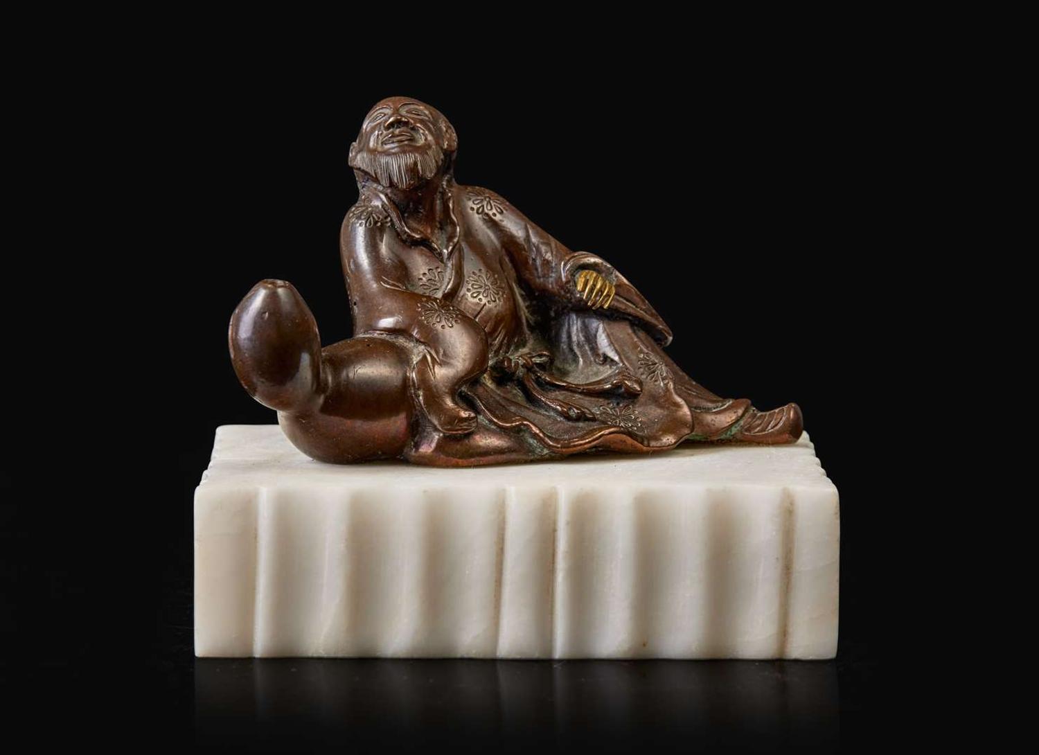 A patinated bronze figural brush rest 太白醉酒銅筆架