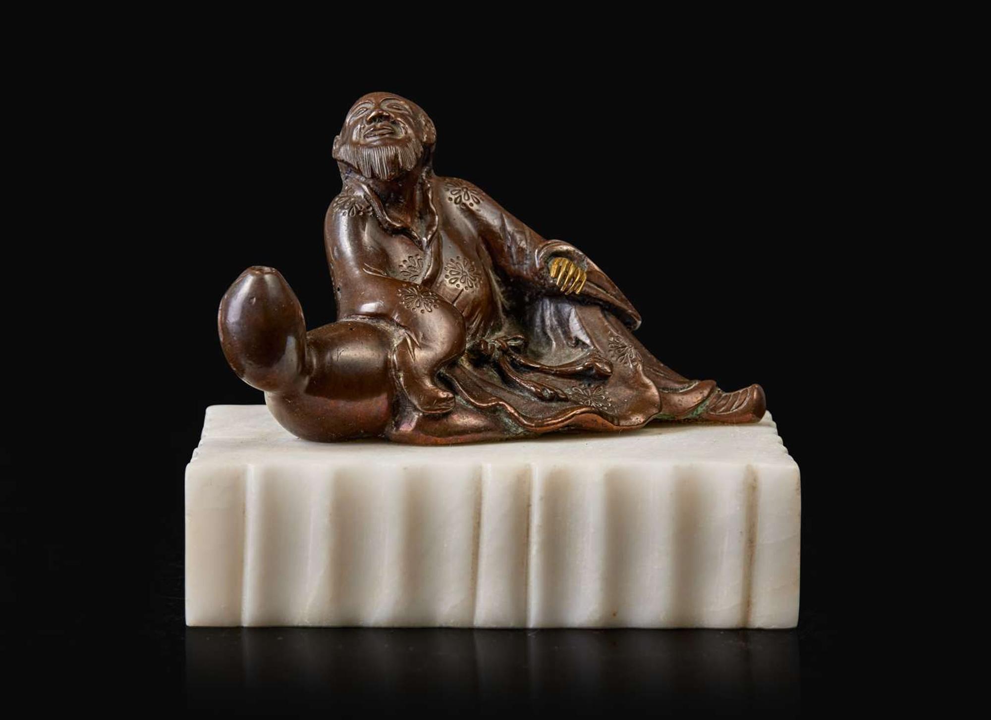 A patinated bronze figural brush rest 太白醉酒銅筆架