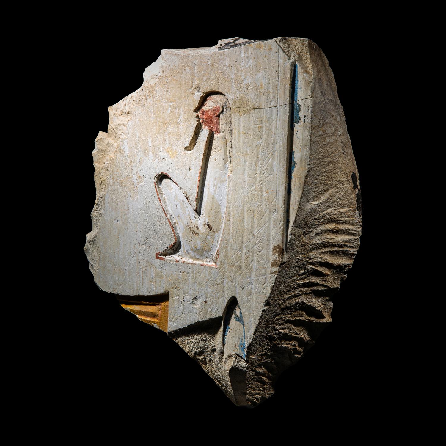 An Egyptian Painted Limestone Relief Fragment