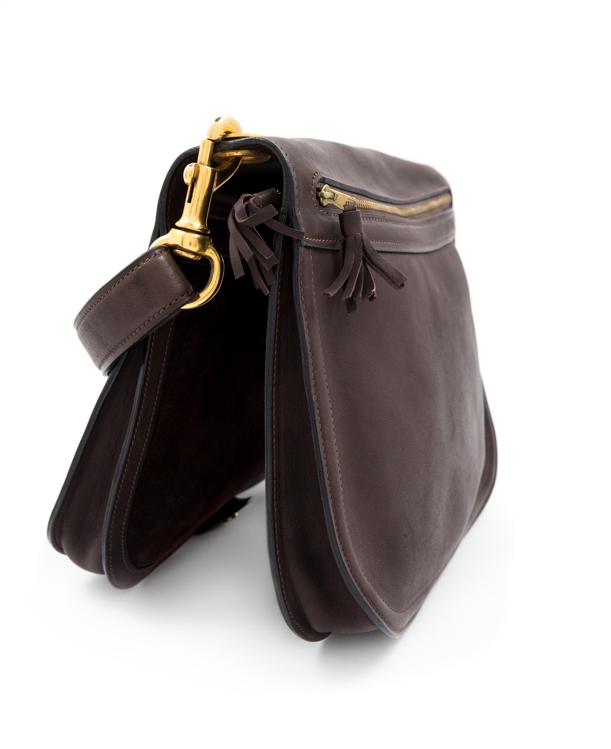 A Gucci Brown Leather Vintage Reversible Saddle Shoulder Bag, 9.75" H x 10.75" W x 2" D; Strap drop: 8.5"- 9".