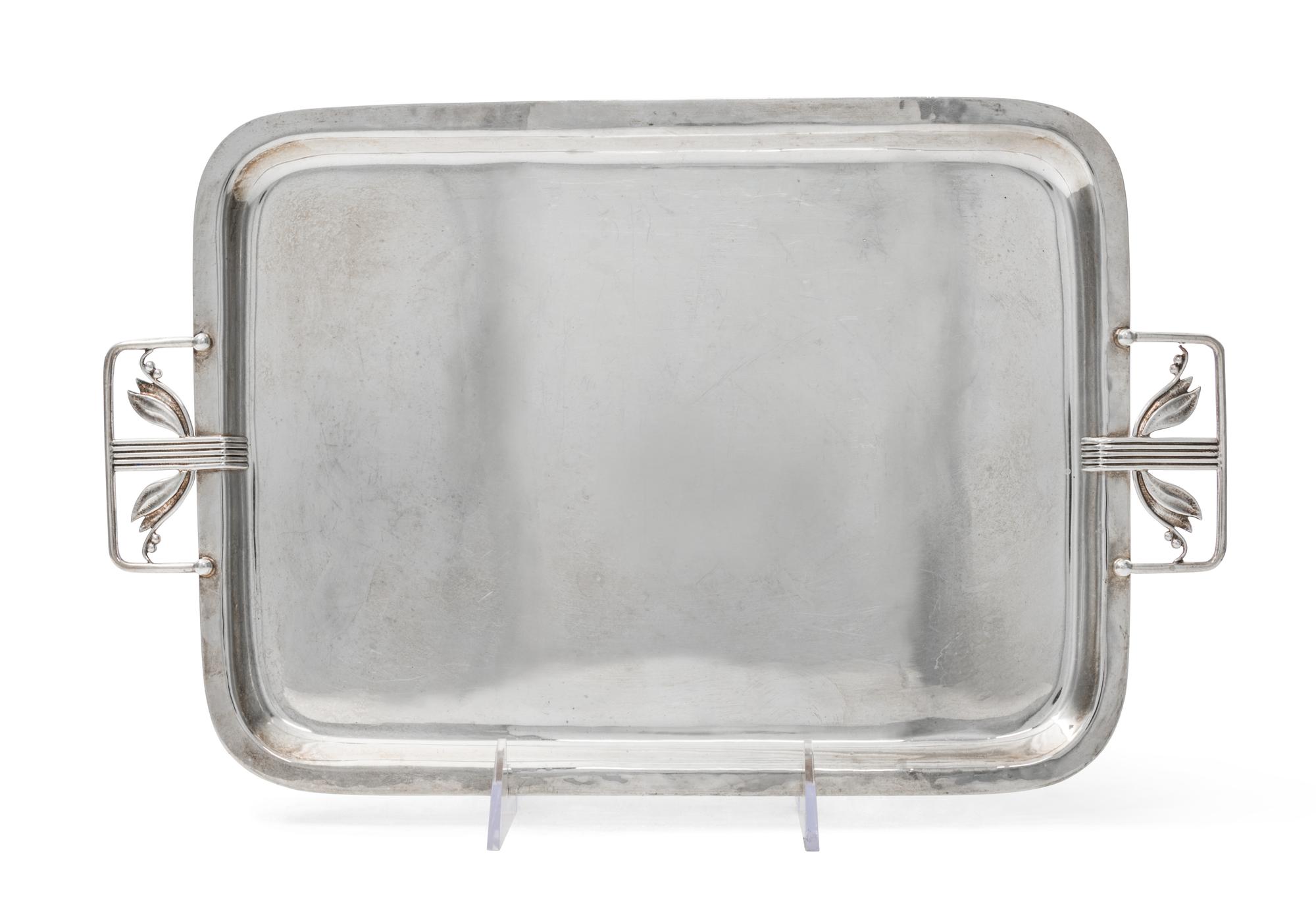 An American Arts and Crafts Silver Tray, Cellini Craft Ltd., Chicago, IL, of rectangular form with rounded corners and applied stylized