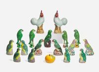 A large collection of seventeen Chinese Export enameled porcelain birds together with a Chinese enameled porcelain persimmon, late 19th and 20th century