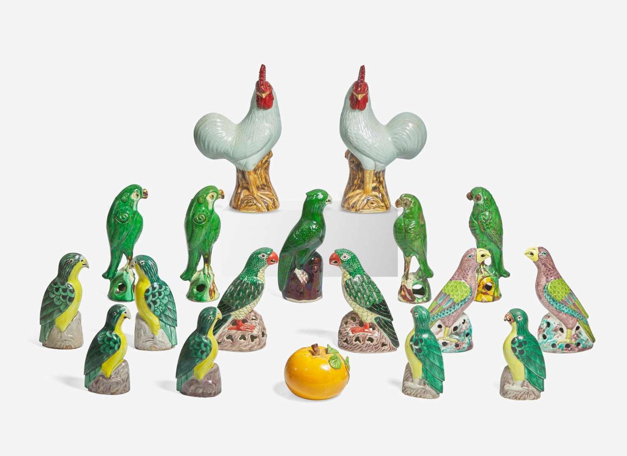 A large collection of seventeen Chinese Export enameled porcelain birds together with a Chinese enameled porcelain persimmon, late 19th and 20th century
