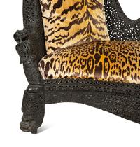 Two Similar Anglo-Burmese Carved Teak Settees