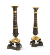 A Pair of Empire Patinated and Gilt Bronze Candlesticks, Height 11 inches.