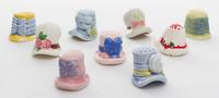 Nine Porcelain Thimbles Height of first 1 1/8 inches.