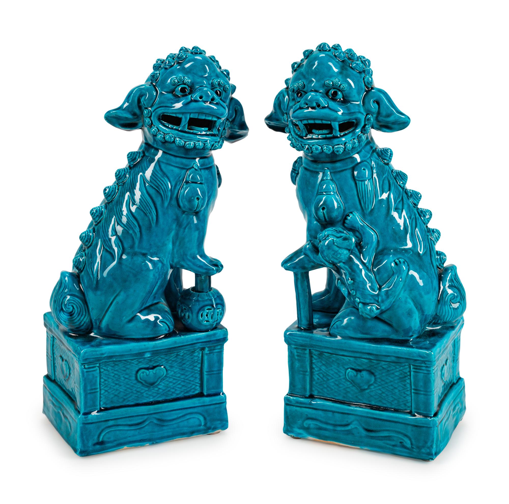 A Pair of Chinese Turquoise-Glazed Pottery Figures of Fu-Lions