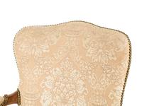 An Italian Carved Walnut Armchair
