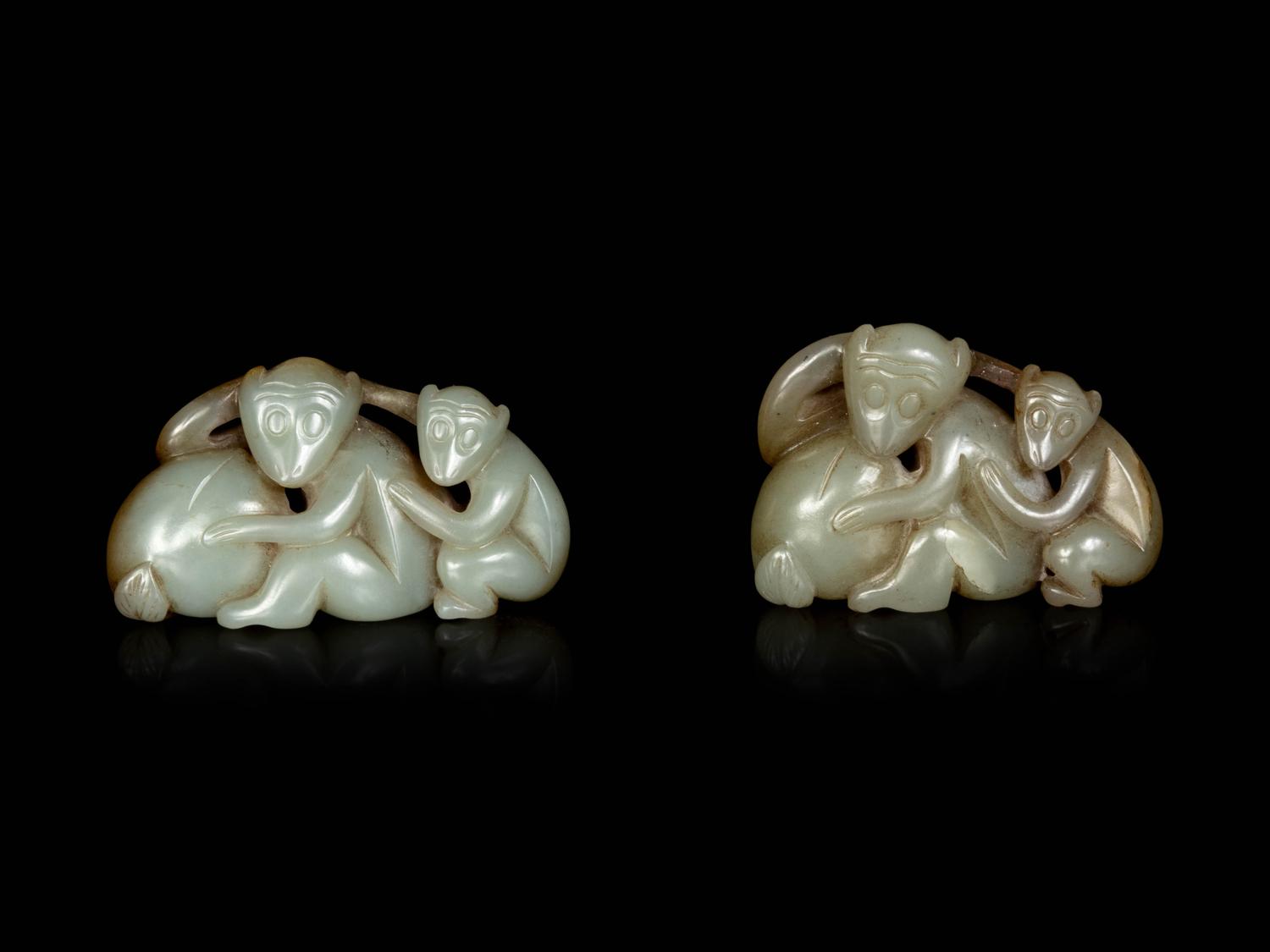 Two Chinese Celadon and Russet Jade Carved Figures of Monkeys