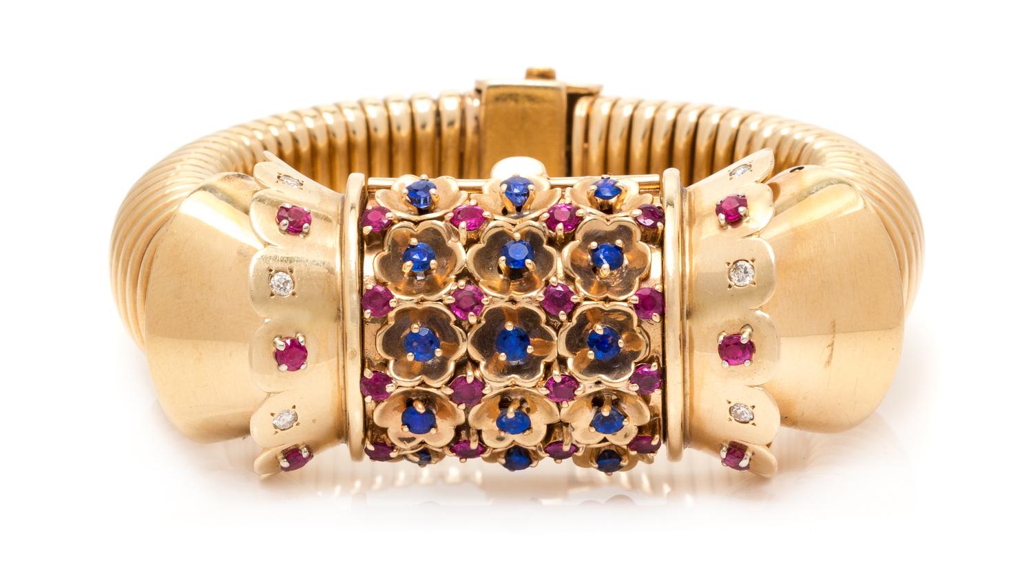 A Retro Rose Gold, Ruby, Sapphire and Diamond Surprise Wristwatch, John Rubel for Cartier, 71.60 dwts.