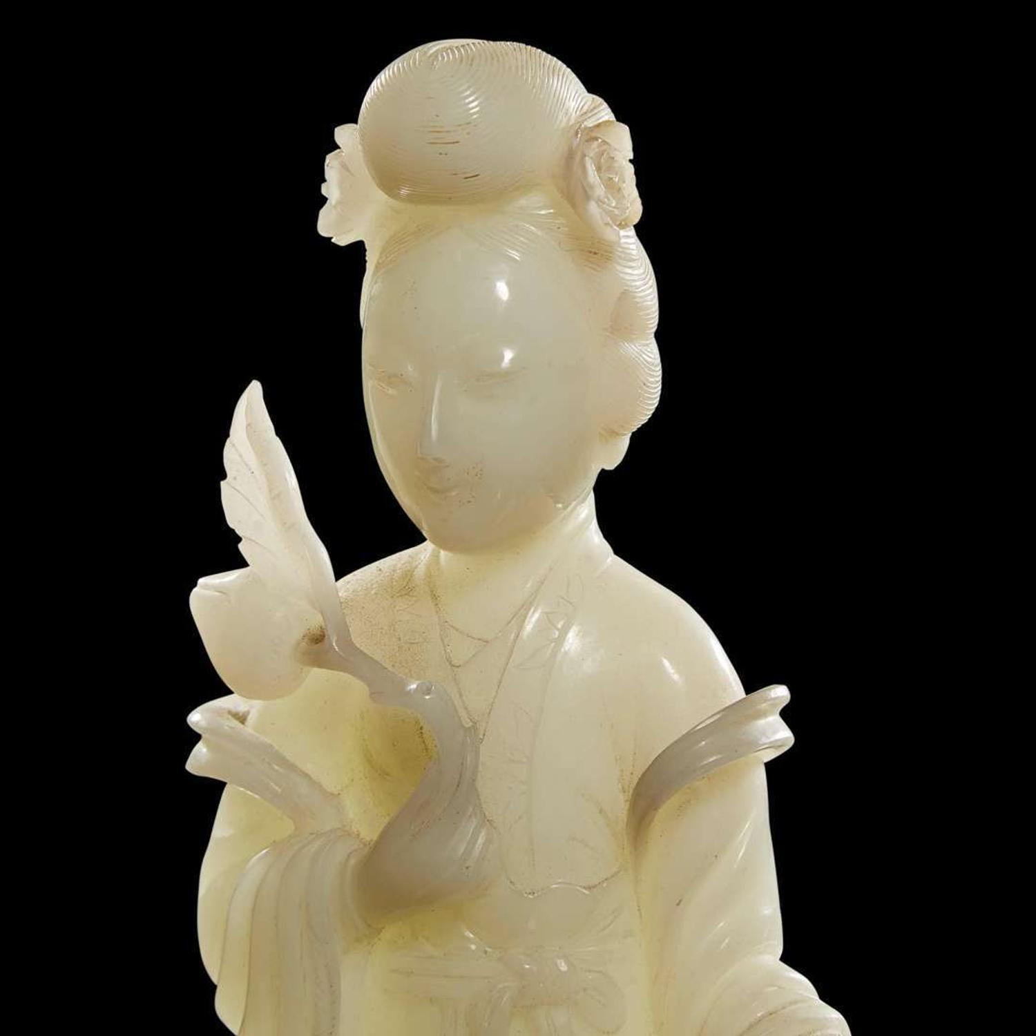 A Chinese carved white jade figure of a meiren 白玉雕美人 19th/early 20th century ????????