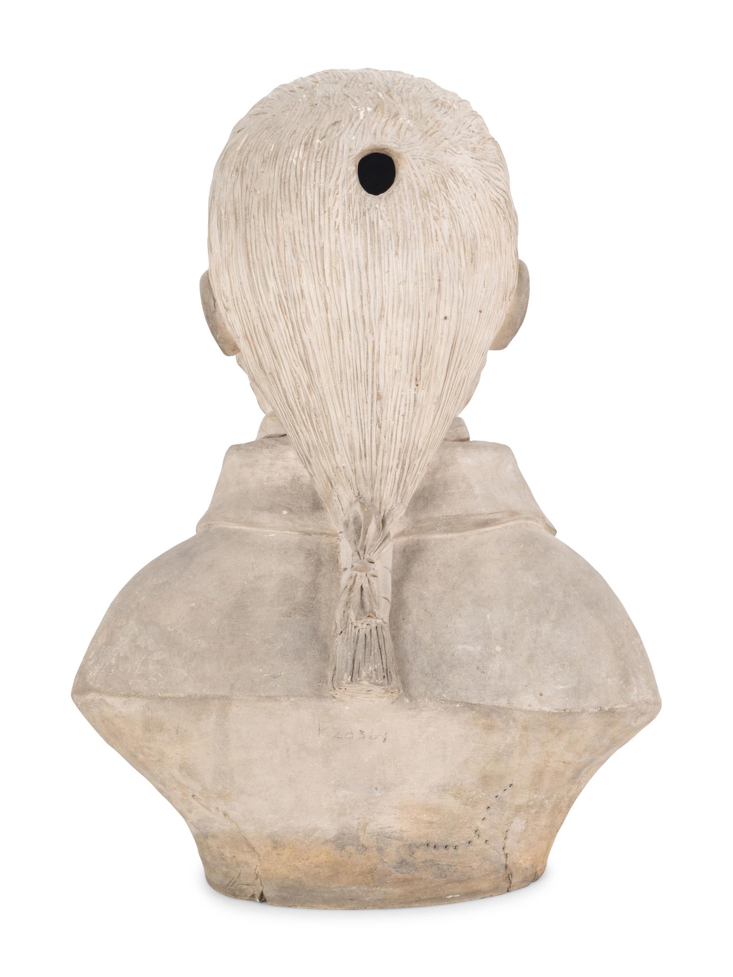 A Gray Plaster Bust of a Young Man