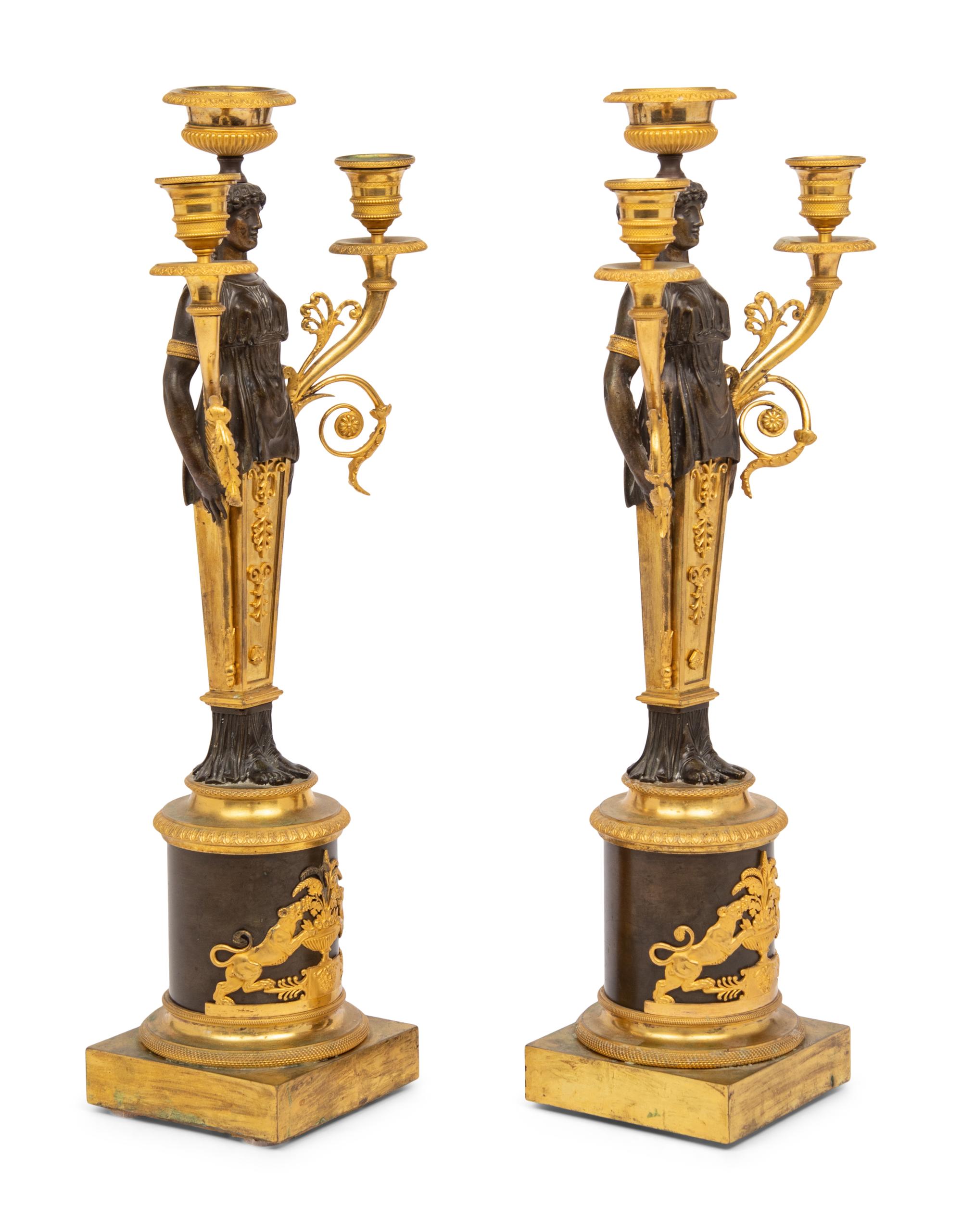 A Pair of Restauration Ormolu and Patinated Bronze Figural Three-Light Candelabra