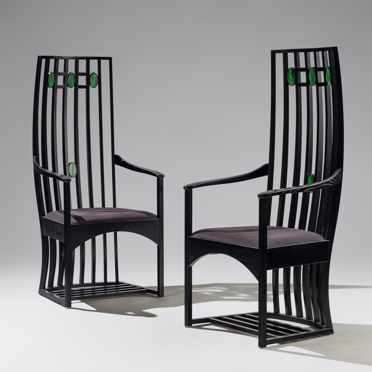Pair of Cassina e bonized armchairs with slag glass inserts