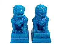 A Pair of Chinese Turquoise Glazed Porcelain Figures of Fu Lions