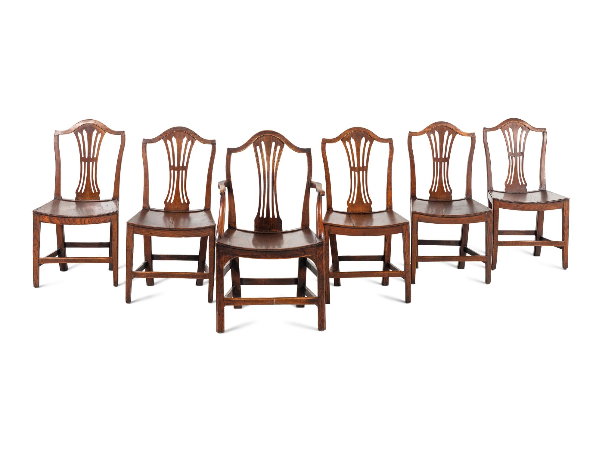 A Set of Six English Carved Oak Dining Chairs