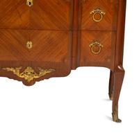 A French Gilt Metal Mounted Mahogany and Kingwood Marquetry Marble-Top Commode