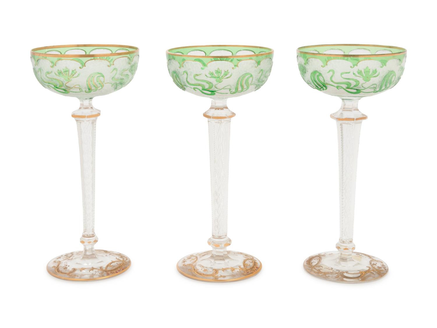 A Group of Three Art Nouveau Parcel-Gilt and Cut-to-Clear Glass Champagne Coupes
