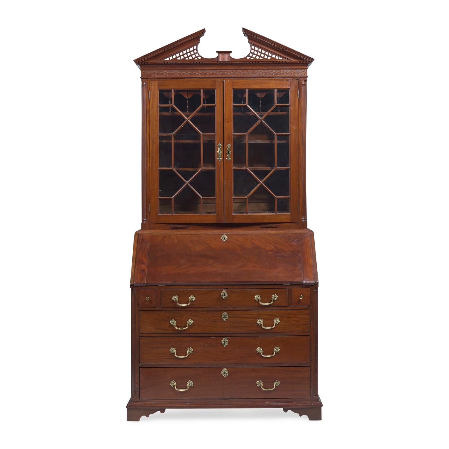 A Chippendale Carved Mahogany Desk-and-Bookcase