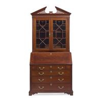 A Chippendale Carved Mahogany Desk-and-Bookcase