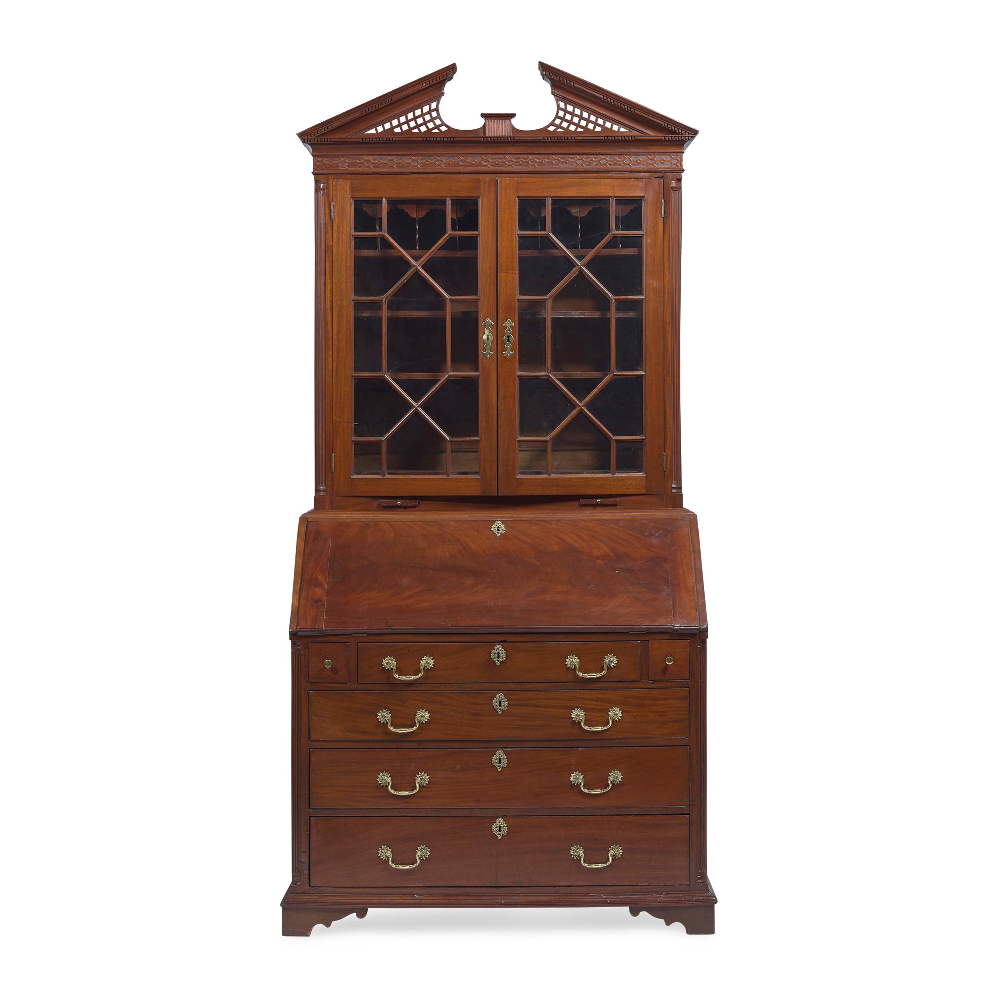 A Chippendale Carved Mahogany Desk-and-Bookcase