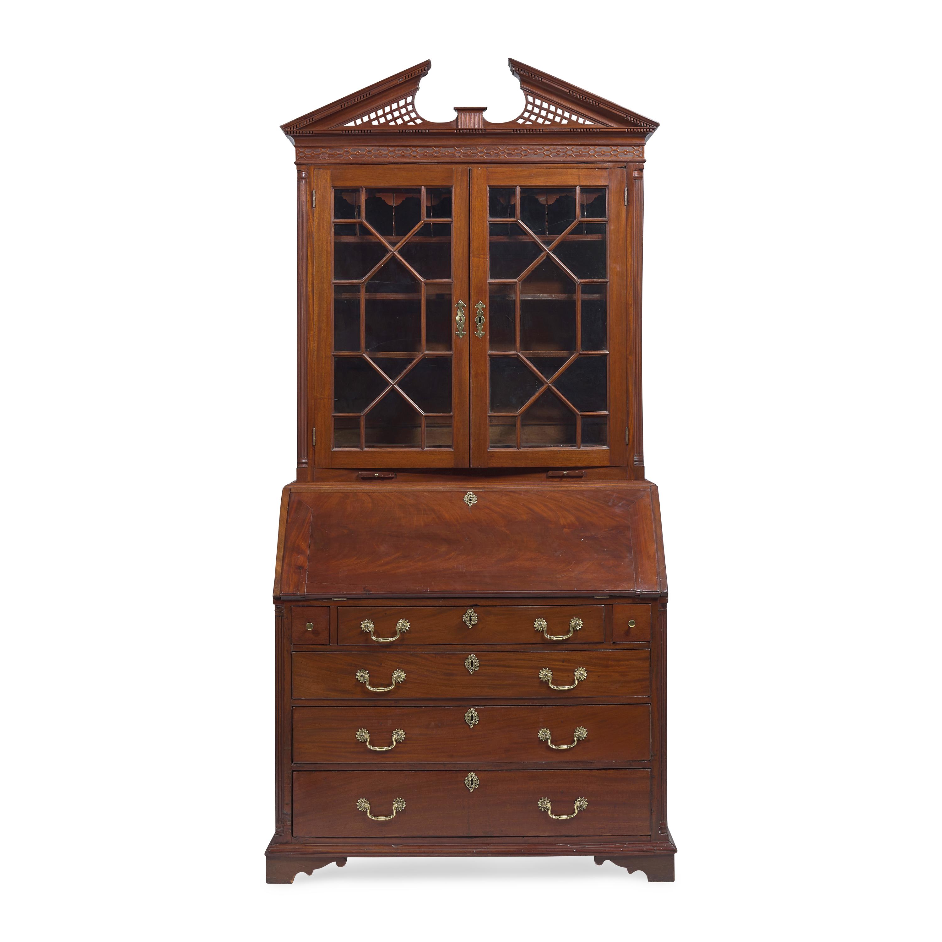 A Chippendale Carved Mahogany Desk-and-Bookcase