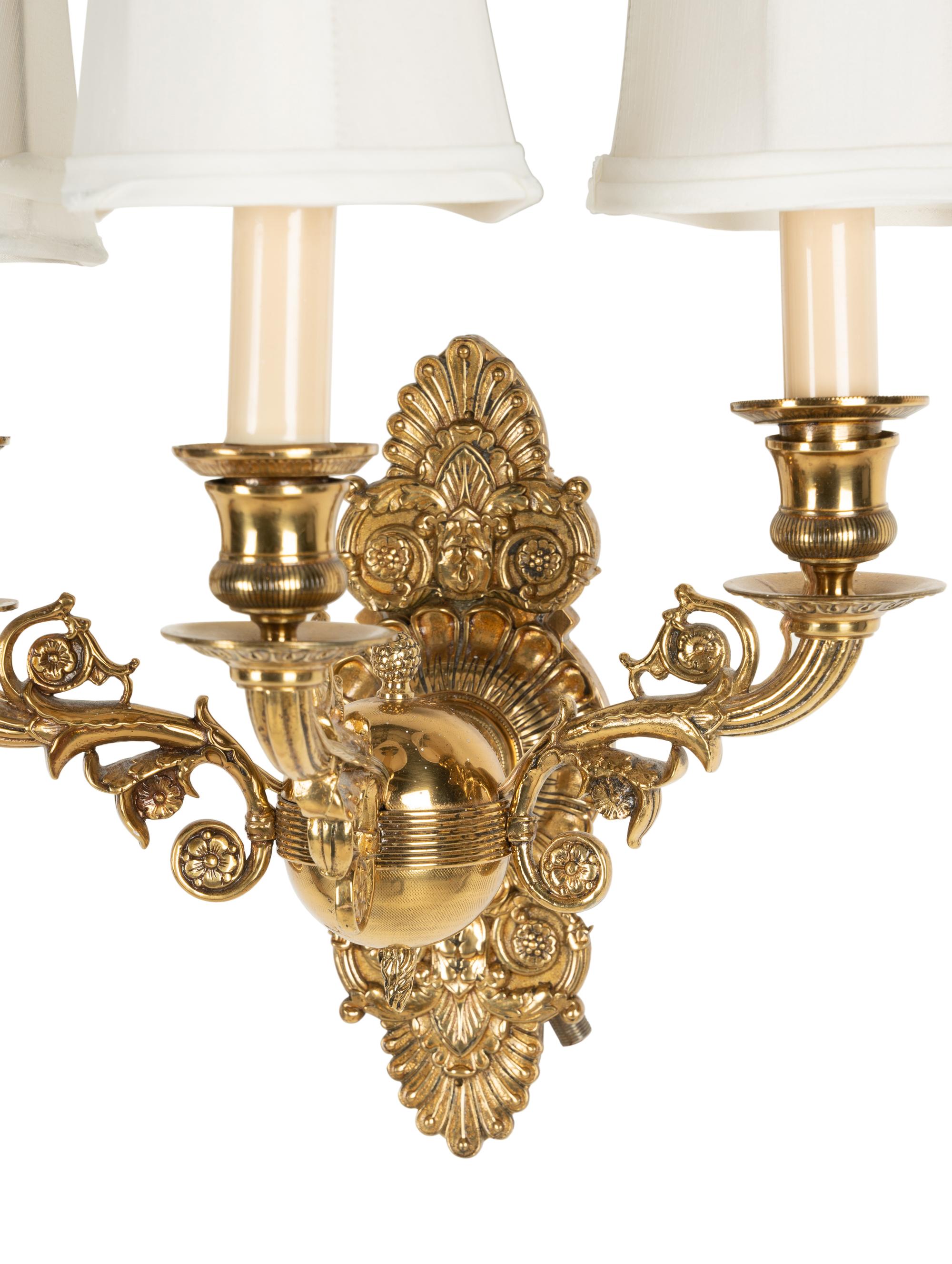 A Pair of Empire Style Brass Three-Light Sconces