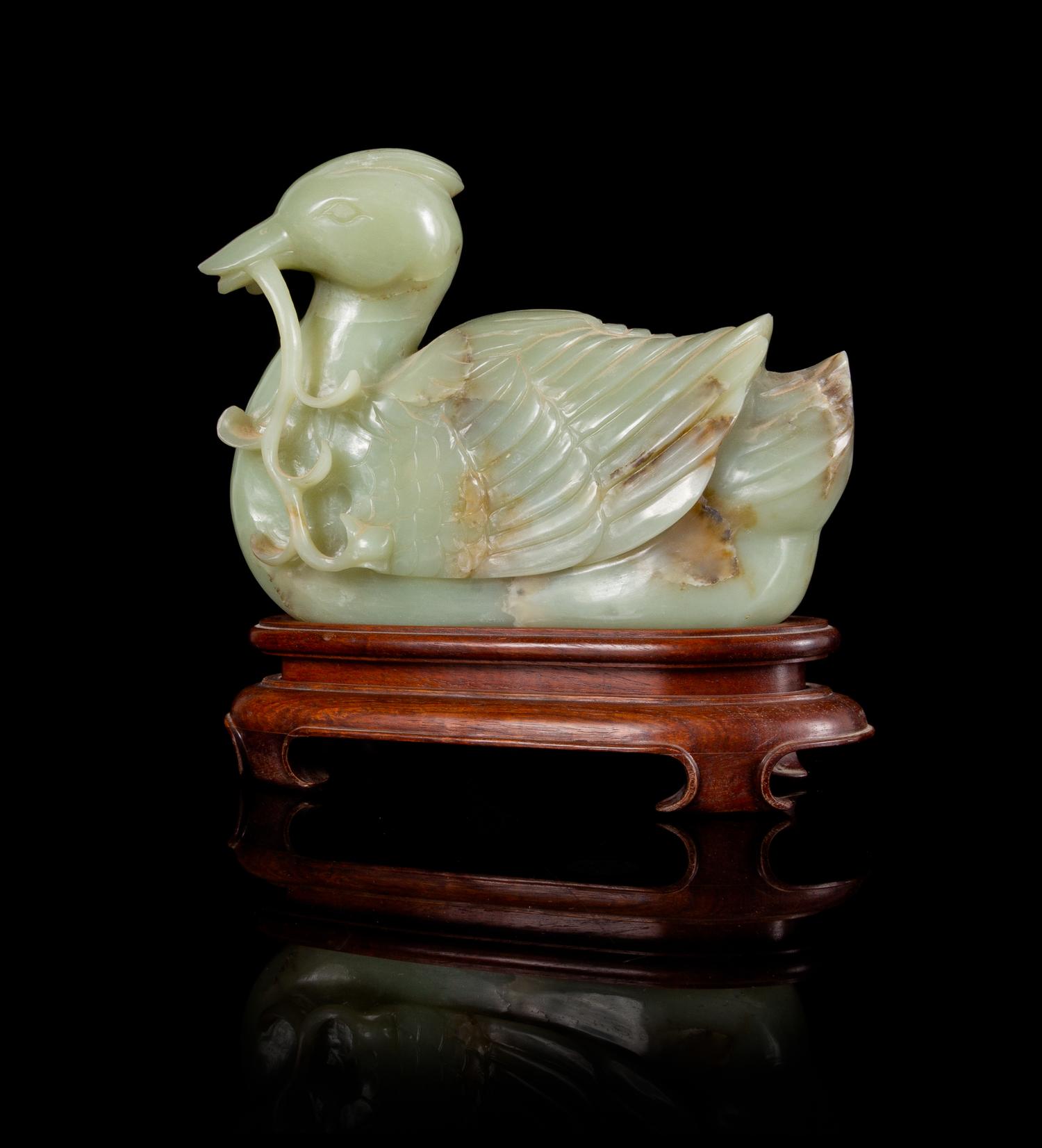 A Celadon and Russet Jade Figure of a Duck Height 6 3/4 inches.