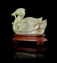 A Celadon and Russet Jade Figure of a Duck Height 6 3/4 inches.