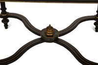 A Napoleon III Style Gilt-Bronze Mounted Ebonized Center Table