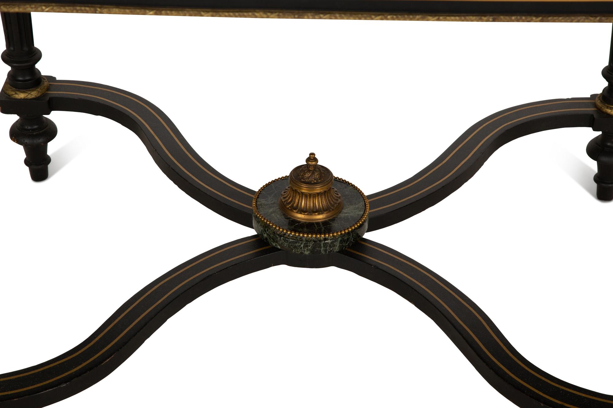 A Napoleon III Style Gilt-Bronze Mounted Ebonized Center Table