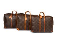 A Group of Three Louis Vuitton Soft-Sided Suitcases, 20th Century