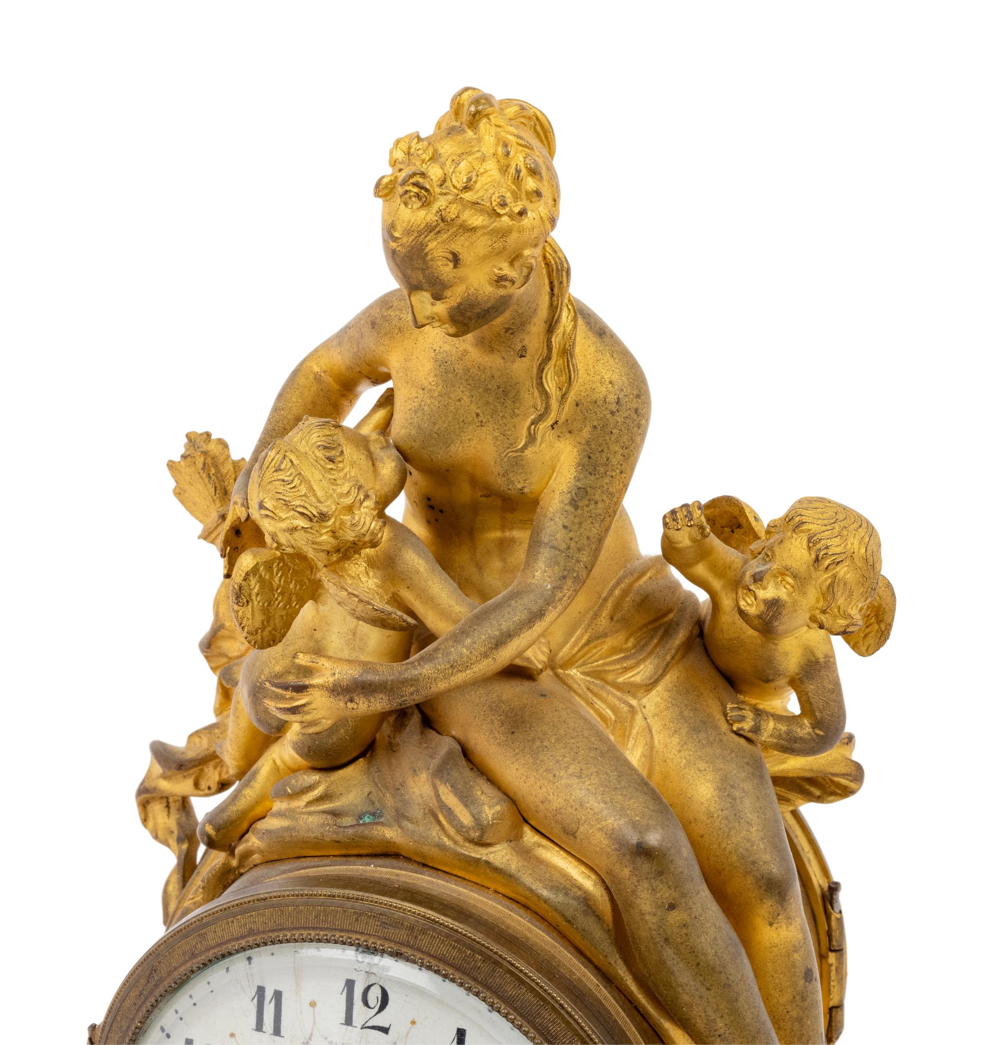 A French Gilt Bronze Figural Mantel Clock