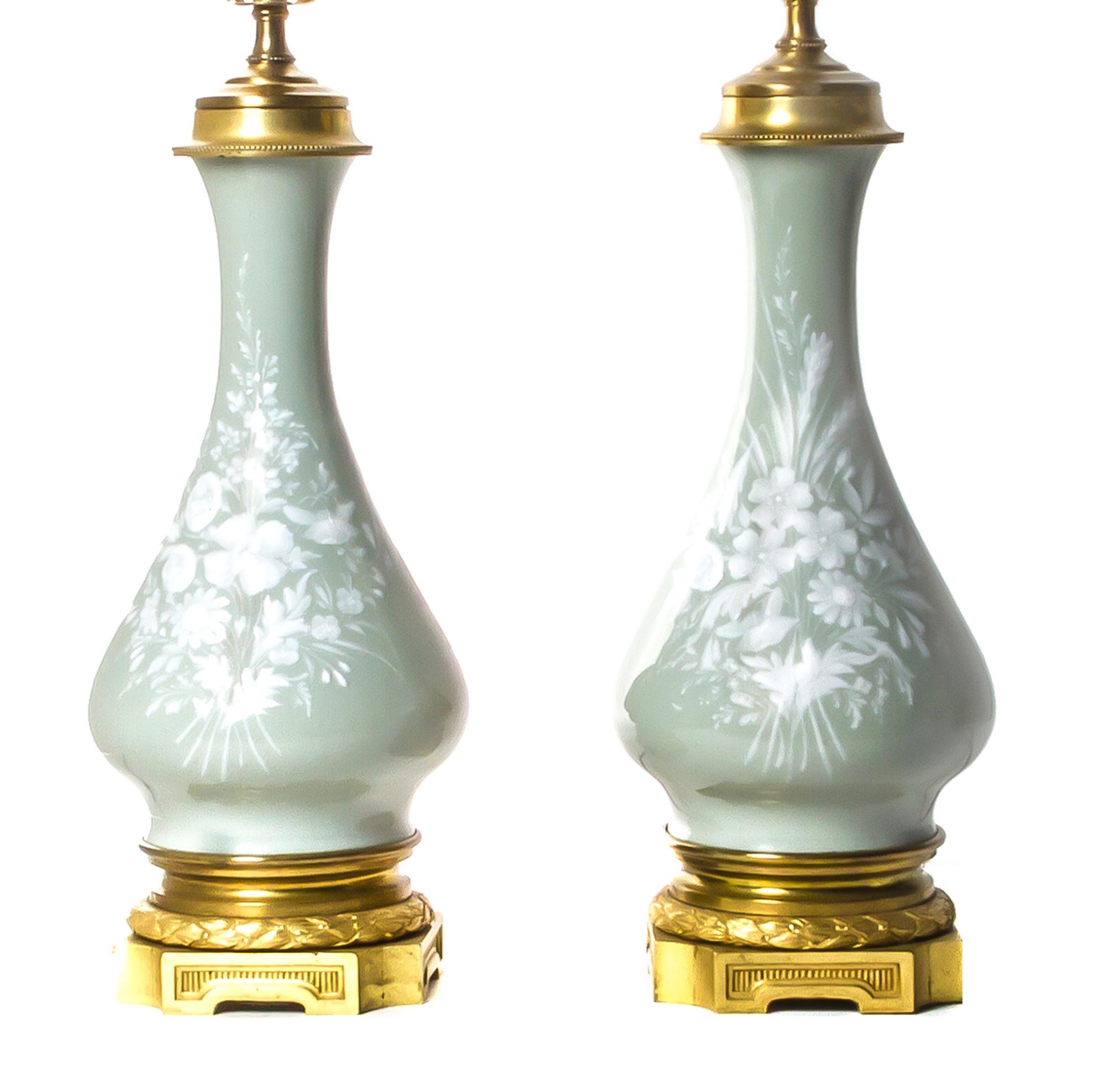 A Pair of Continental Pate-sur-Pate Celadon Vases, Height 25 1/2 inches.