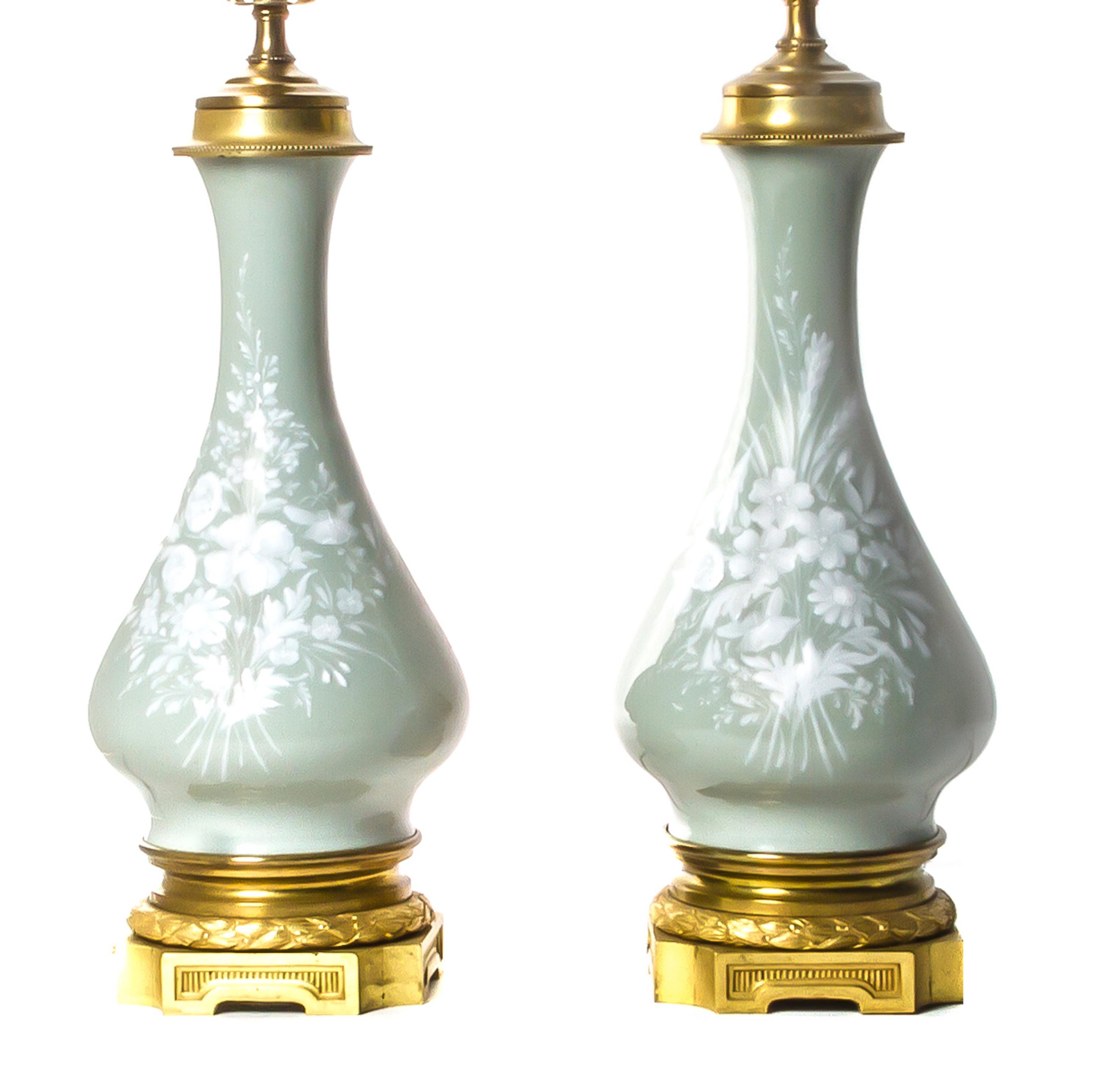A Pair of Continental Pate-sur-Pate Celadon Vases, Height 25 1/2 inches.