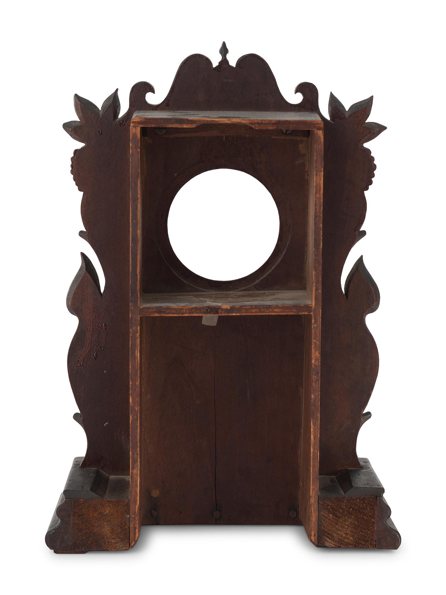 A Carved Walnut Folk Art Clock Hutch