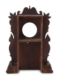 A Carved Walnut Folk Art Clock Hutch