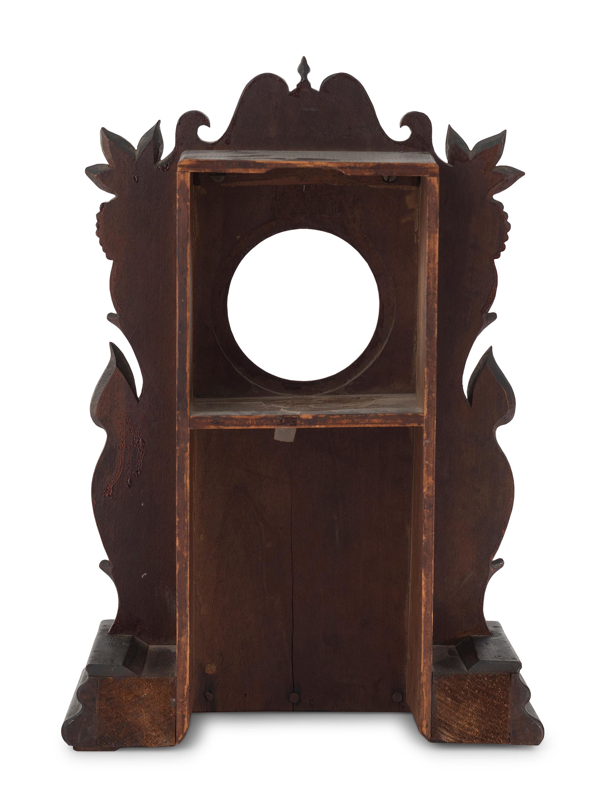 A Carved Walnut Folk Art Clock Hutch