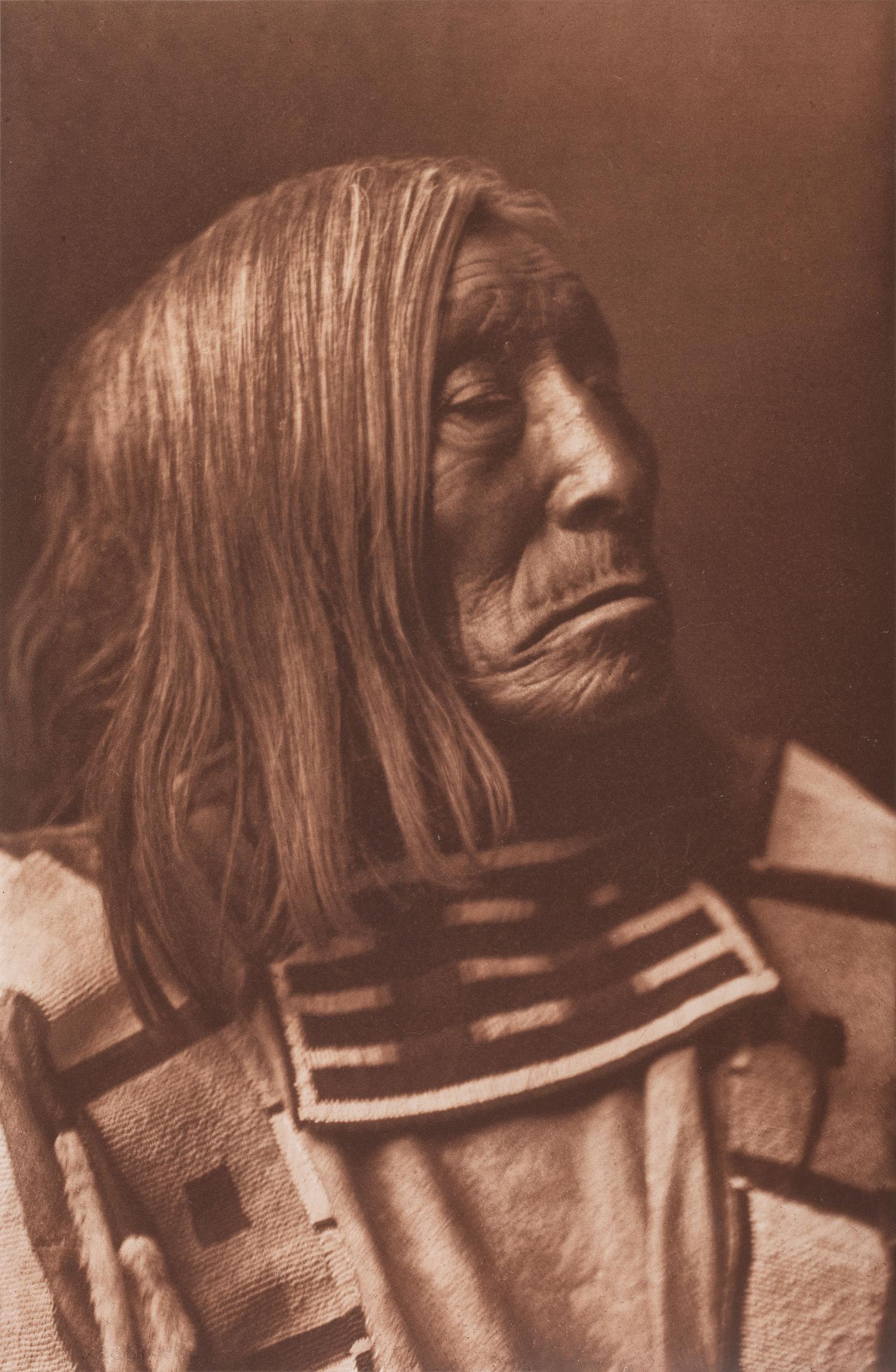 CURTIS, Edward (1868-1952), photographer. A group of 2 portfolio photogravures featuring Apsaroke subjects.