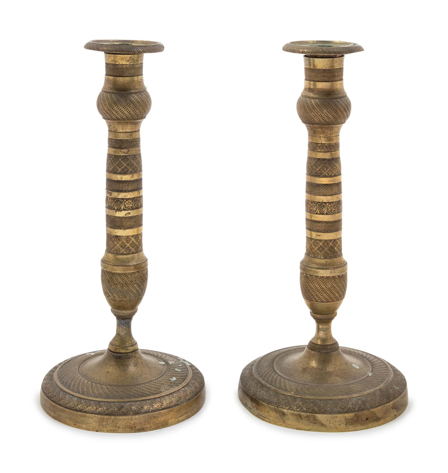 A Pair of Empire Style Brass Candlesticks