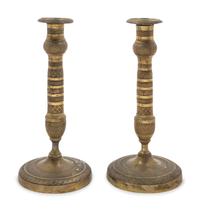 A Pair of Empire Style Brass Candlesticks