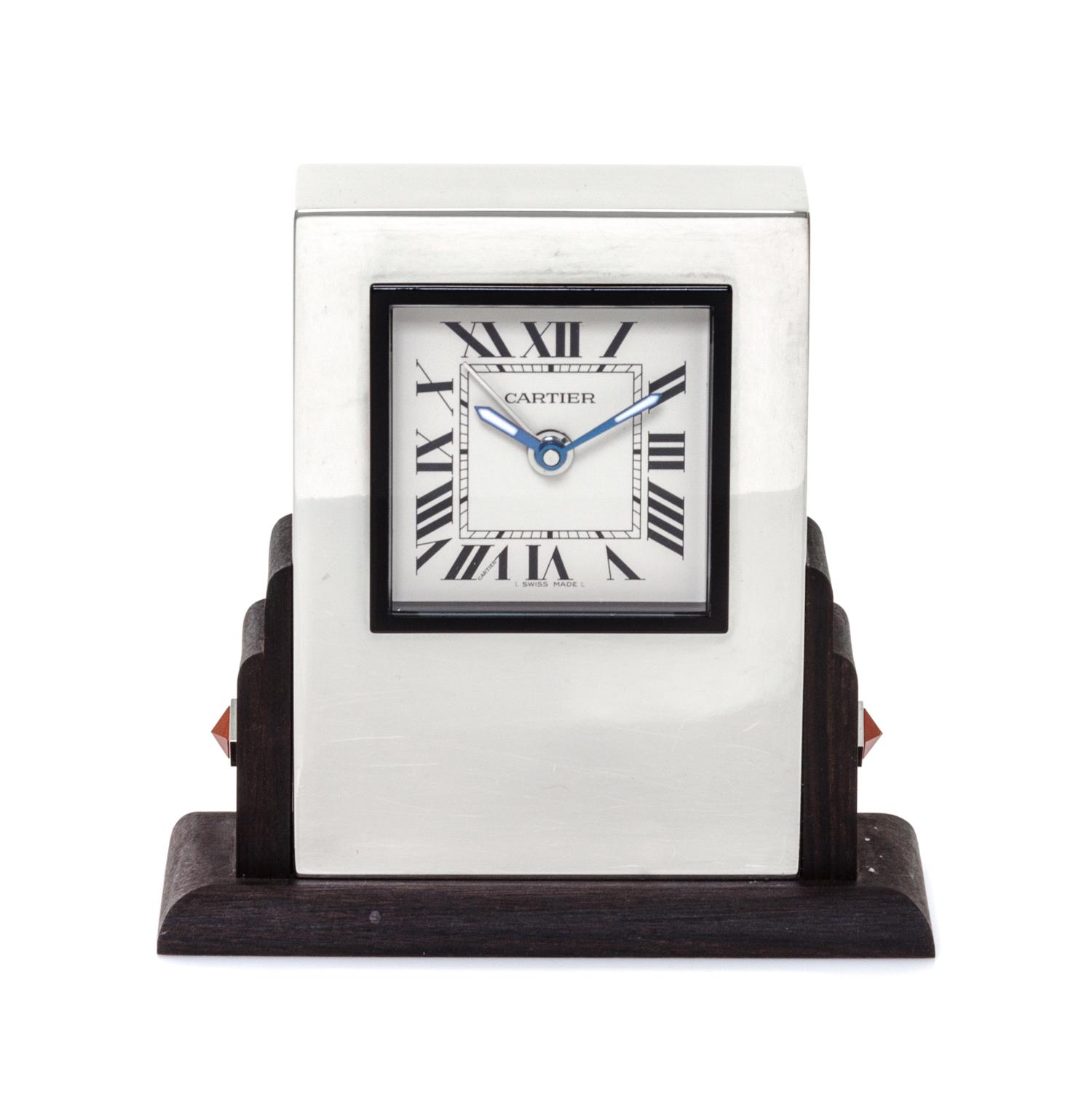 A Cartier Art Deco Style Travel Alarm Clock Height 3 1/2 x width 3 3/8 x depth 1 3/8 inches. — 20TH CENTURY