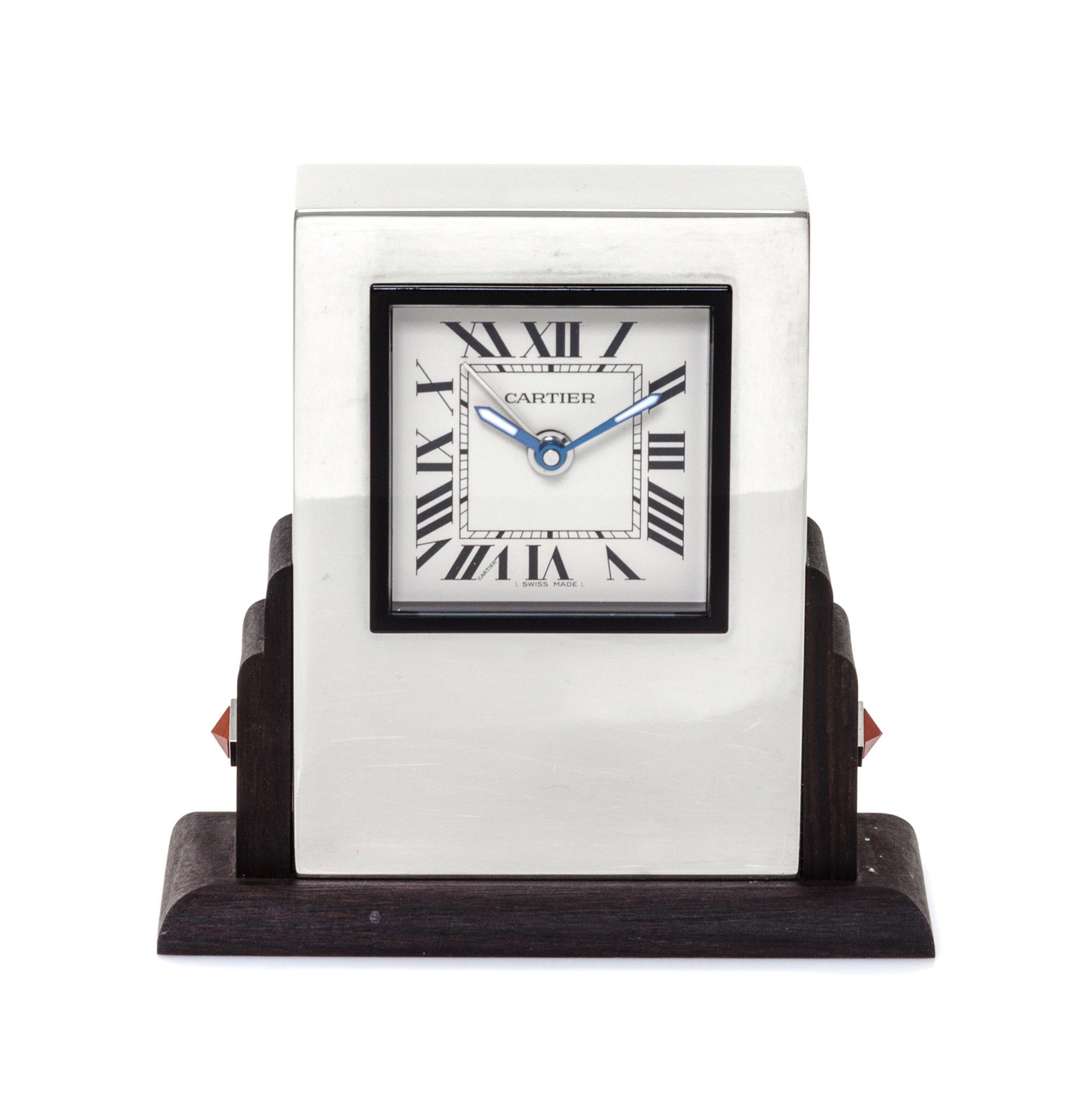 A Cartier Art Deco Style Travel Alarm Clock Height 3 1/2 x width 3 3/8 x depth 1 3/8 inches. — 20TH CENTURY