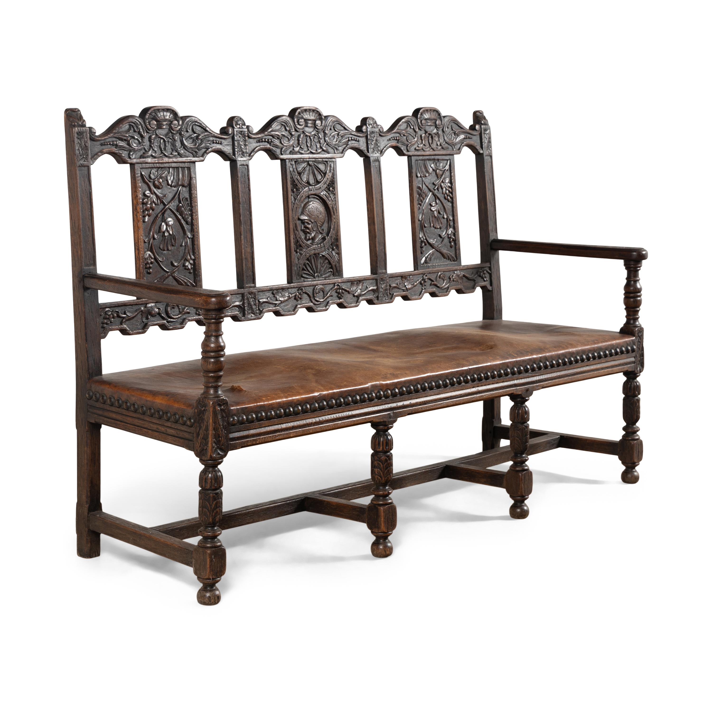 A Continental Carved Oak Hall Bench