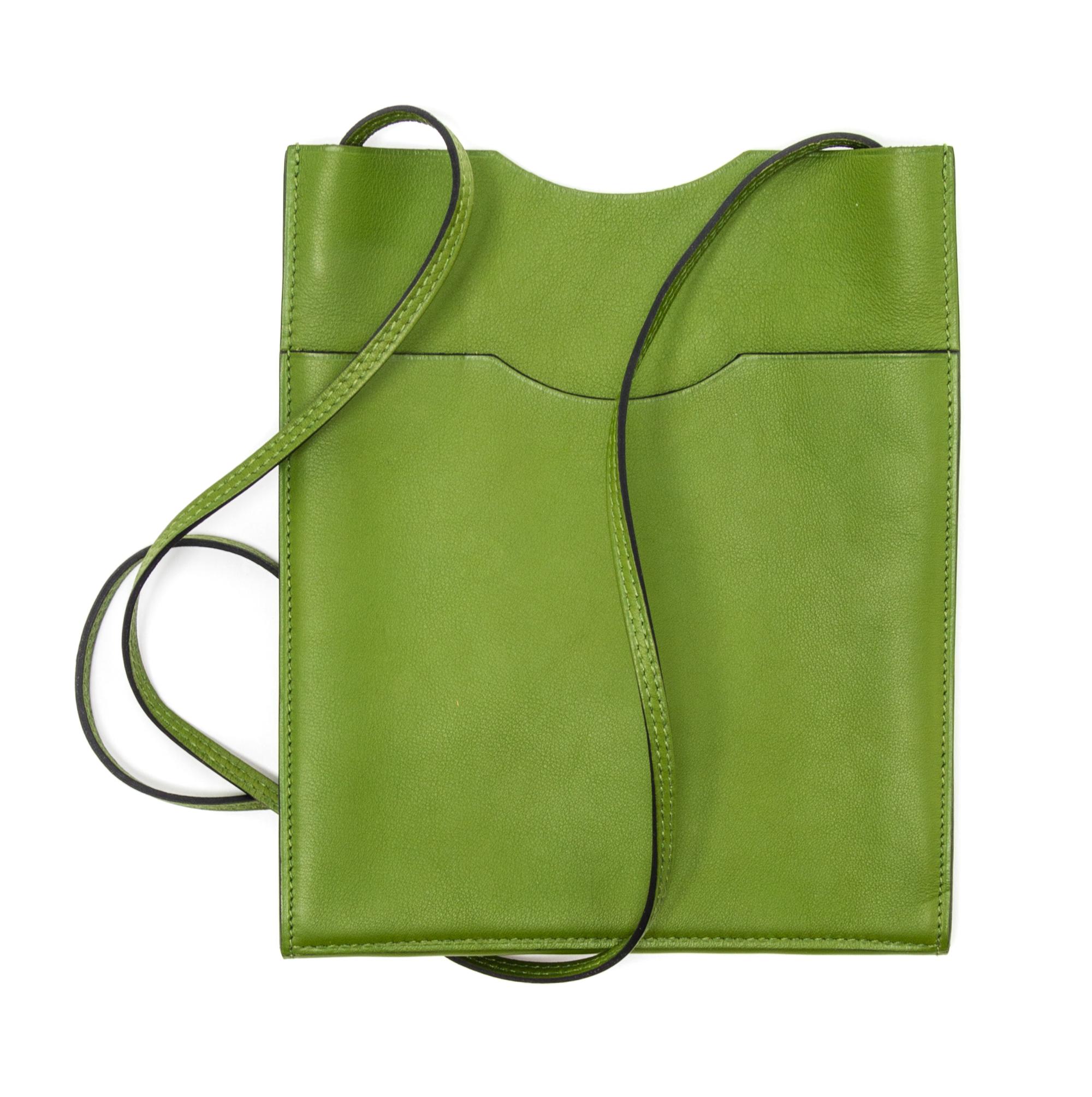 An Hermes Vert Anis Leather Passport Pouch, 7" x 8" x 1".
