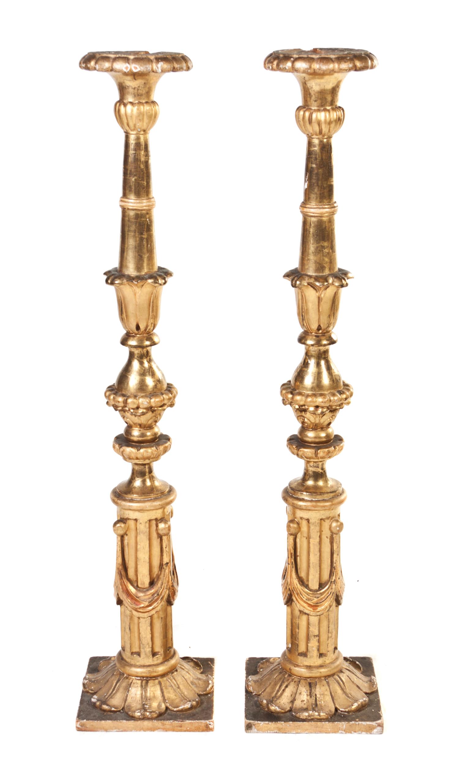 A Pair of Italian Giltwood Pricket Sticks, Height 52 1/4 inches.