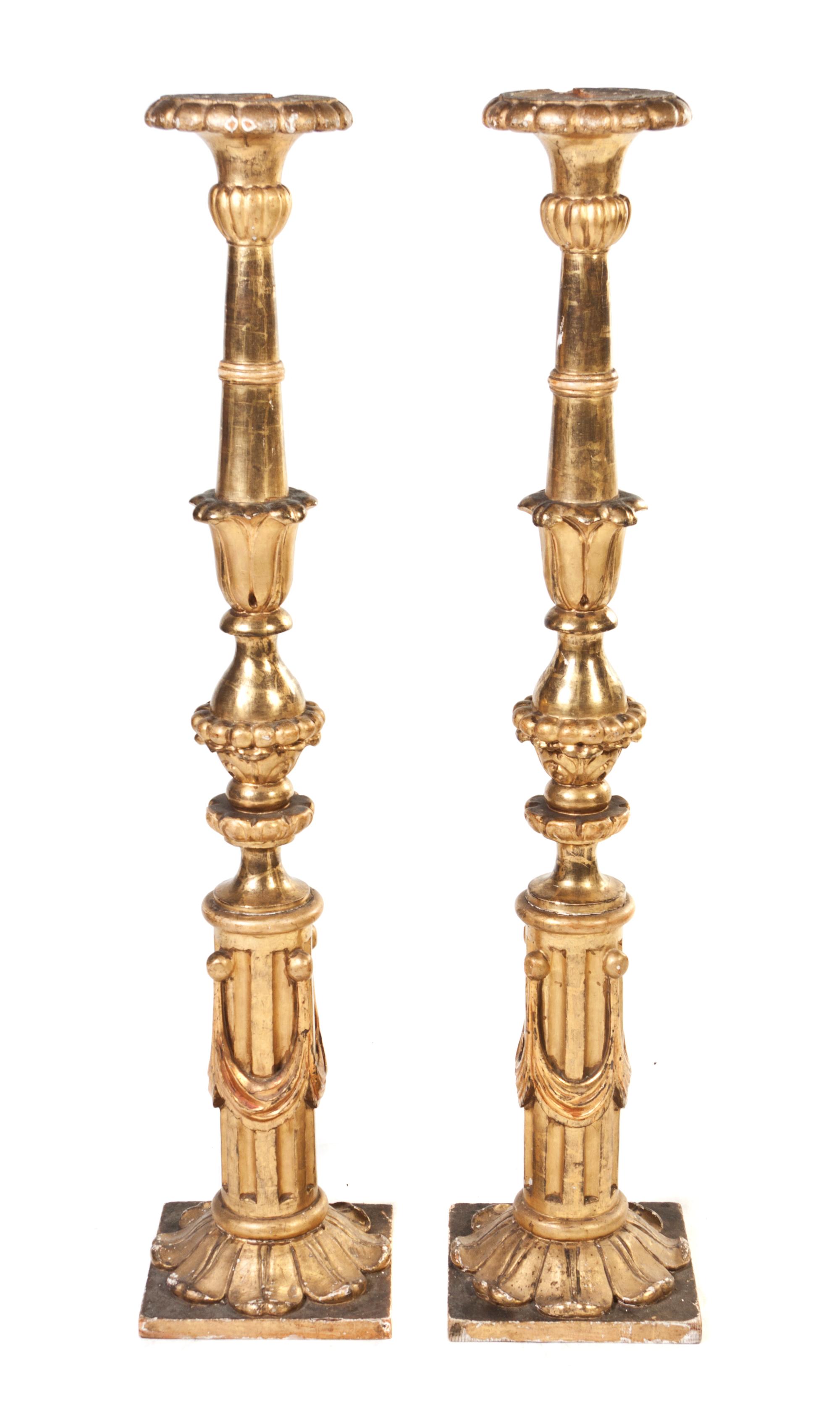 A Pair of Italian Giltwood Pricket Sticks, Height 52 1/4 inches.