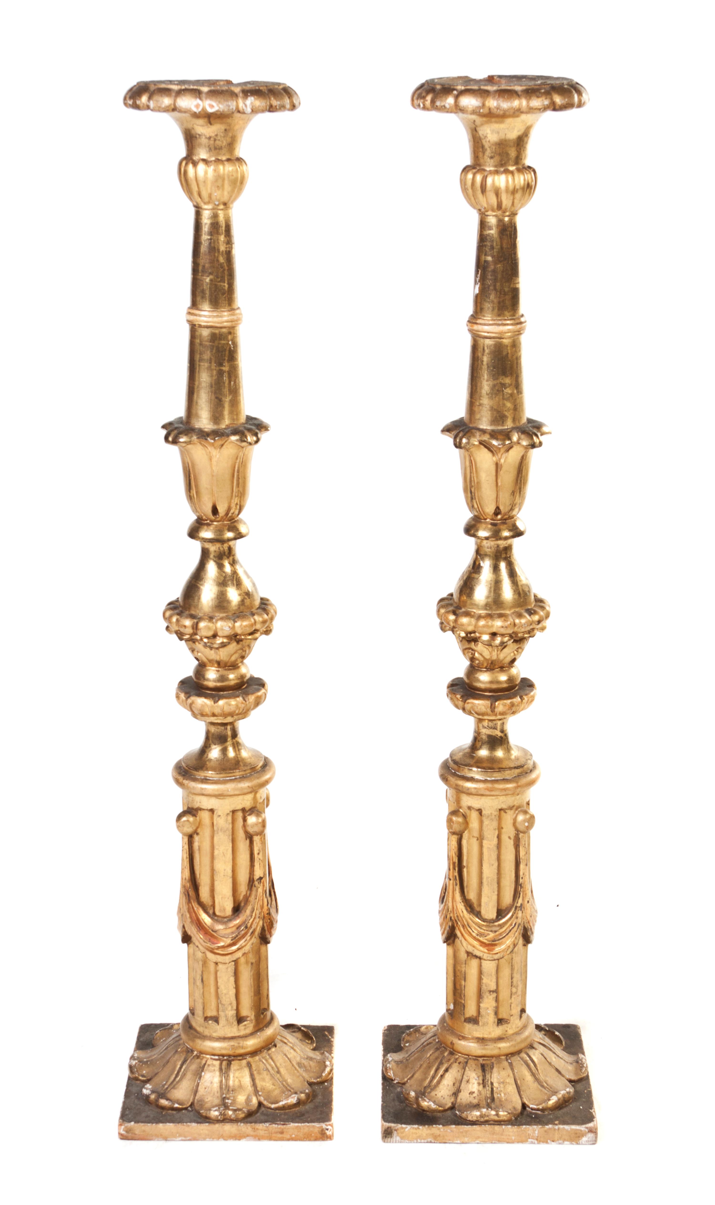 A Pair of Italian Giltwood Pricket Sticks, Height 52 1/4 inches.